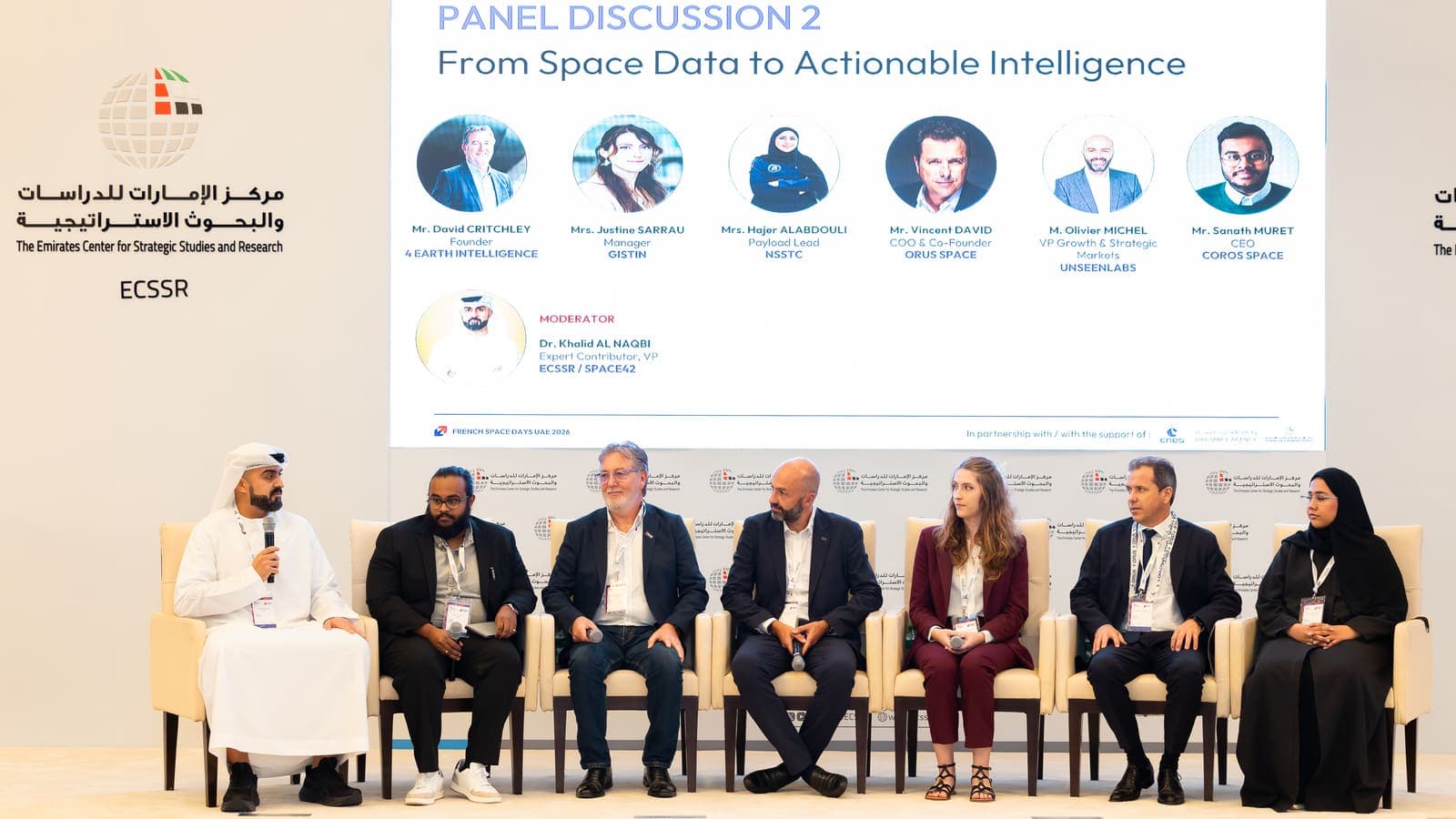 The panel From Space Data to Actionable Intelligence on stage at the ECSSR, with the moderator and six speakers